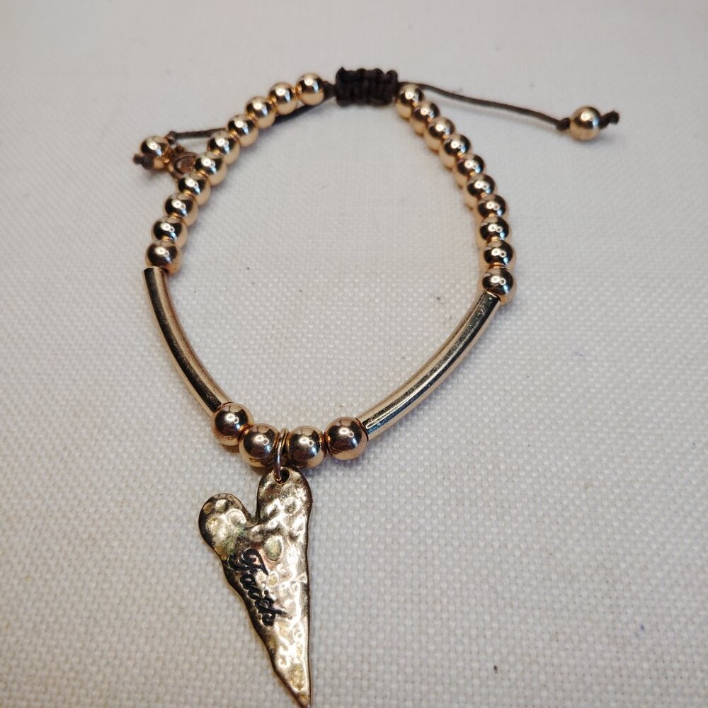 C1946 Gold Tone Faith Bracelet with Heart Charm Adjustable Macrame Cord